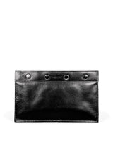 Subtle pebbled black leather toiletry bag with white accent stitches, 4 large silver snaps closure. Black nylon lining. 2 interior slip pockets and main compartment. Upcycled, circular, sustainable. Front view.