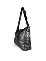 Back/side 3/4 view of black leather handbag with a strap with a brushed nickel buckle and d-ring on a white background