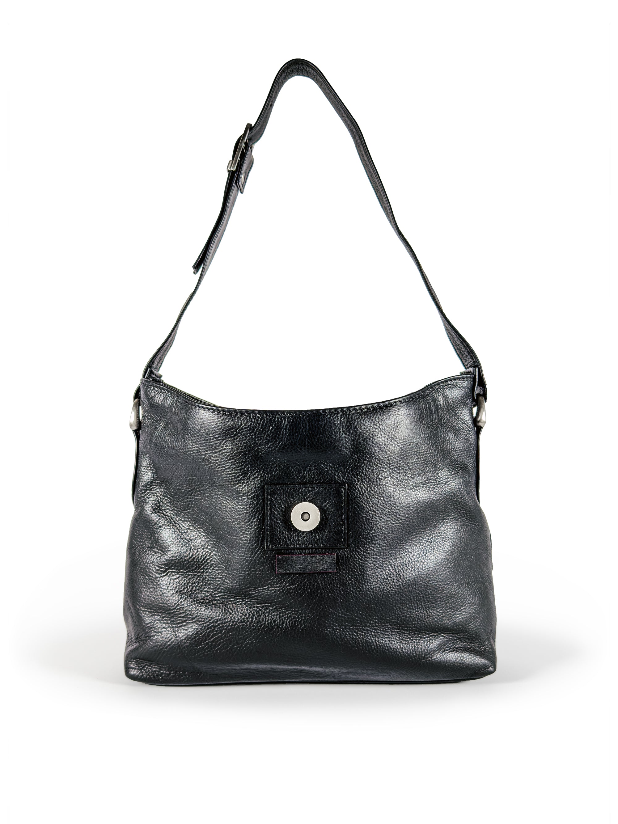 Black leather handbag open with a magnet closure detail on a white background