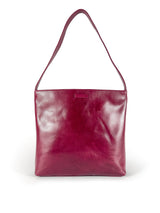 Medium polished burgundy leather handbag. Elegant muted pink satin lining. Sunken zipper closure. Front view 1. Upcycled, circular, sustainable.