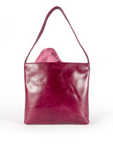 Medium polished burgundy leather handbag. Elegant muted pink satin lining. Sunken zipper closure. Lining view 1. Upcycled, circular, sustainable.