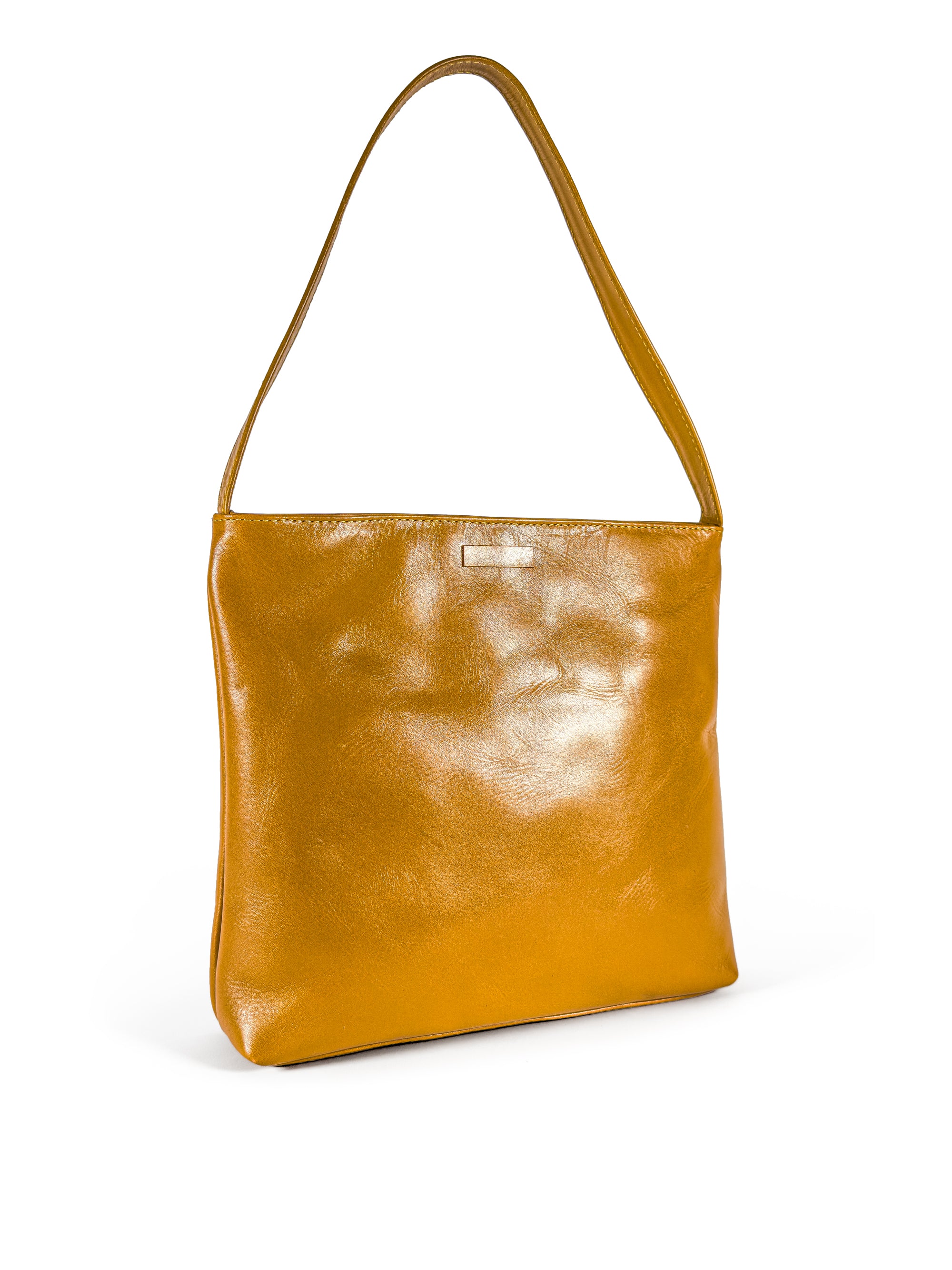 3/4 view 1 of a medium polished tan leather handbag. Elegant muted lemon satin lining. Zipper closure. Front view. Upcycled, circular, sustainable.