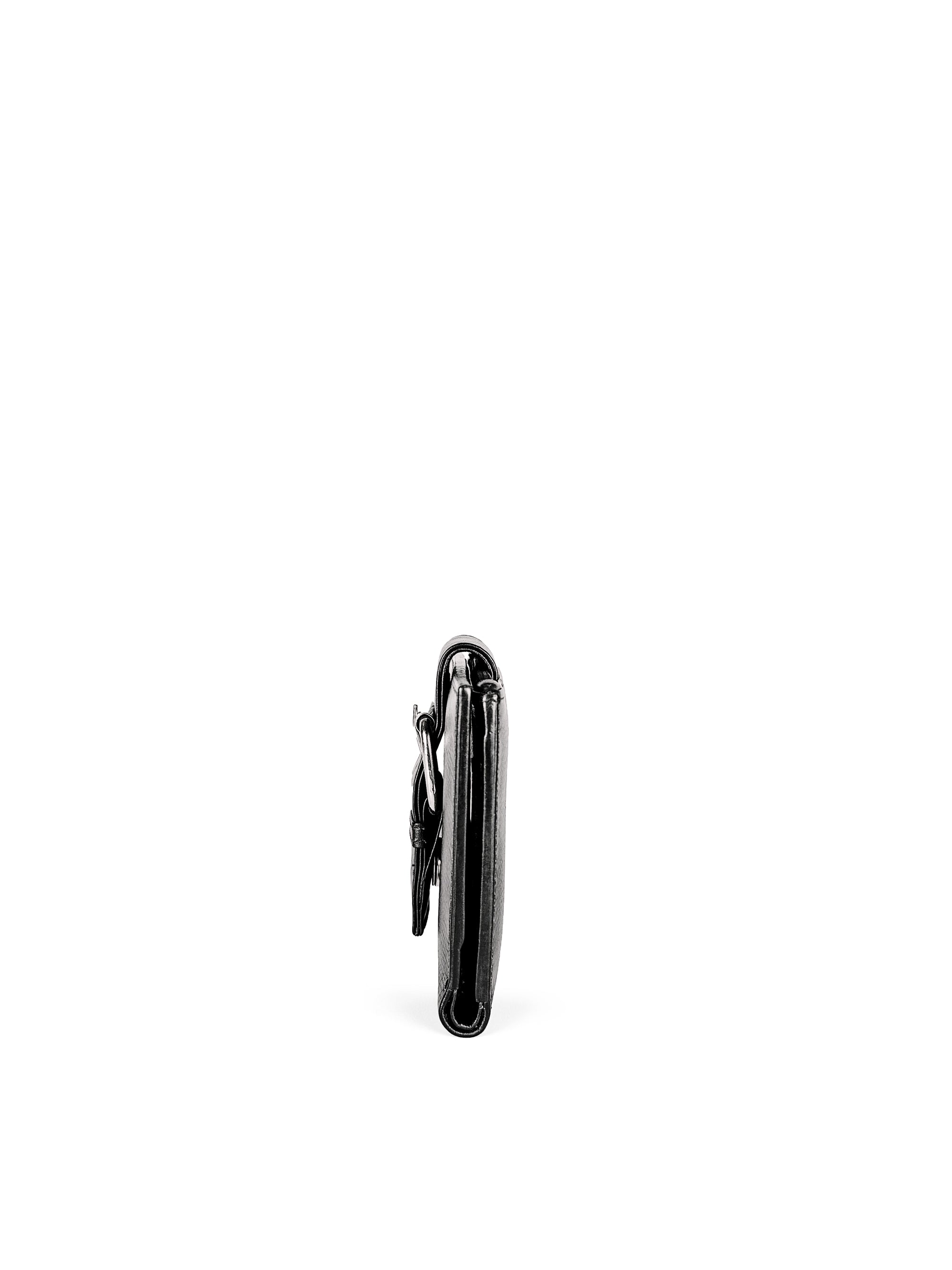 Small Wallet. Buttery pebbled black leather with nickel hardware. 1 magnet closure hidden under wide strap with buckle. Profile view. Upcycled, circular, sustainable.