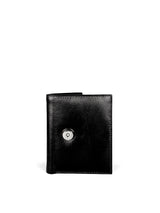 Small Wallet. Buttery pebbled black leather with nickel hardware. 1 magnet closure hidden under wide strap with buckle. Upcycled, circular, sustainable. hidden magnet closure view.
