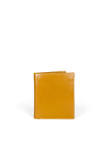 Polished tan leather mini wallet. Elegant muted lemon satin lining. Upcycled, circular, sustainable. Front view 1.