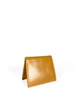 Polished tan leather mini wallet. Elegant muted lemon satin lining. Upcycled, circular, sustainable. 3/4 view 2.