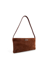 Small slim chestnut-brown suede luxury handbag. Polished brown leather shoulder strap. Elegant copper satin lining and contrast stitch accent. Sunken antiqued bronze metal zipper closure. 3/4 view. Upcycled, circular, sustainable.