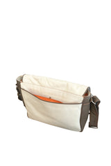 Olive & cream pebbled leather messenger bag, vivid orange satin interior. Padded cross body strap. Back panel slip pocket. Back view. Upcycled, circular, sustainable.