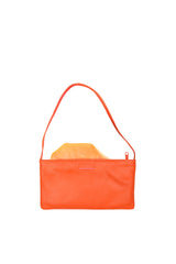 Small slim vivid orange leather handbag. Playful pale orange satin lining and contrast stitch accent. Sunken zipper closure. Lining view. Upcycled, circular, sustainable.