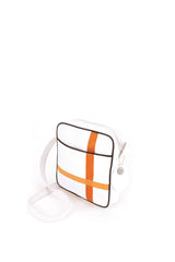 Square medium cross body bag, white coil zip closure, all white lightly distressed leather with two toned orange silkscreen off-center cross, black piping. Silver buckle on adjustable cross body strap. Upcycled, circular, sustainable. 3/4 back view.