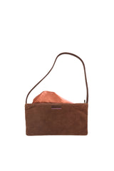 Small slim chestnut-brown suede luxury handbag. Polished brown leather shoulder strap. Elegant copper satin lining and contrast stitch accent. Sunken antiqued bronze metal zipper closure. Lining view. Upcycled, circular, sustainable.