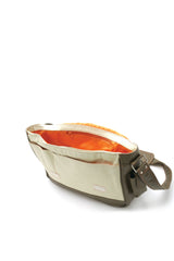 Olive & cream pebbled leather messenger bag, vivid orange interior. Padded cross body strap.