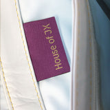 House of JX - White & dark grey leather small messenger bag. White lining, yellow stitches. Padded cross body strap. Plum & gold woven label detail. Upcycled, sustainable
